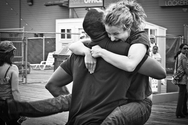 A couple being reunited again. Image: Derriel Street Photography, Flickr. 